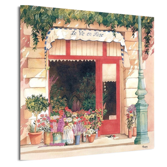 a charming flower shop with a red door and a white awning displaying the name "La Vie en Rose". The shop is filled with an array of colorful flowers and plants, creating a vibrant and inviting atmosphere.
