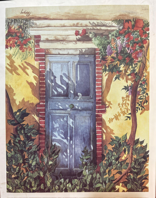 a blue door set in a lush garden, surrounded by vibrant flowers and foliage.